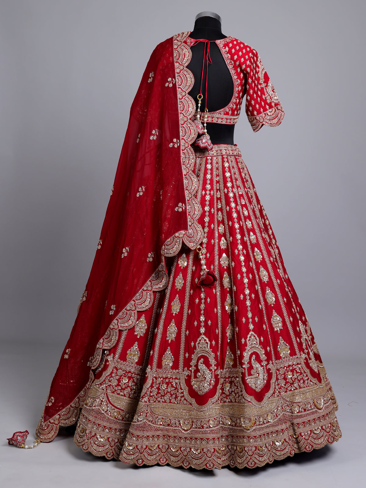 Red silk bridal lehenga choli with exquisite zardosi embellishments