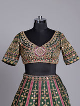 Green raw silk wedding wear lehenga choli with rich work
