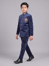Navy velvet boys Jodhpuri suit with ornate crest detailing