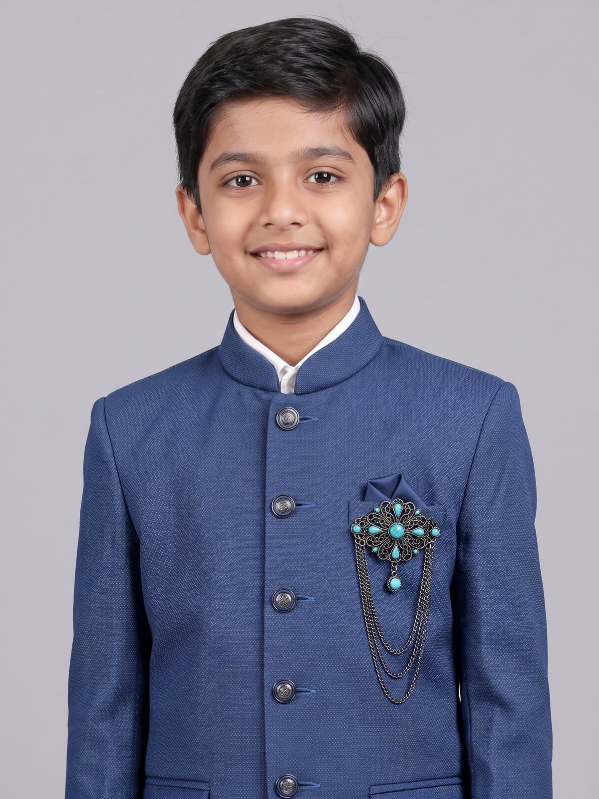 Blue terry rayon boys Jodhpuri suit with metallic brooch