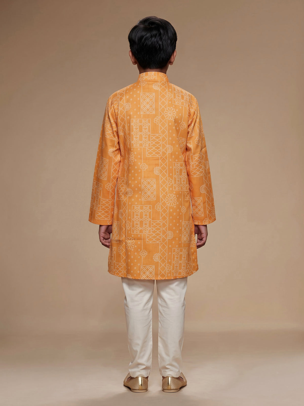Light orange boys linen kurta suit with bandhani print