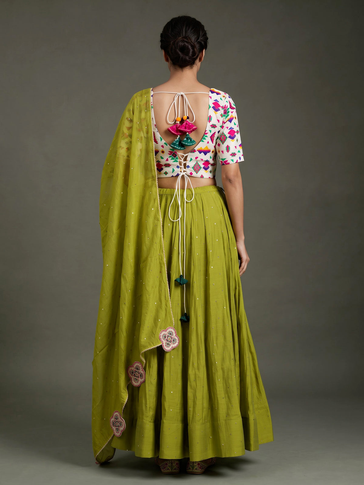 Green soft silk Navratri lehenga choli with delicate stone detailing