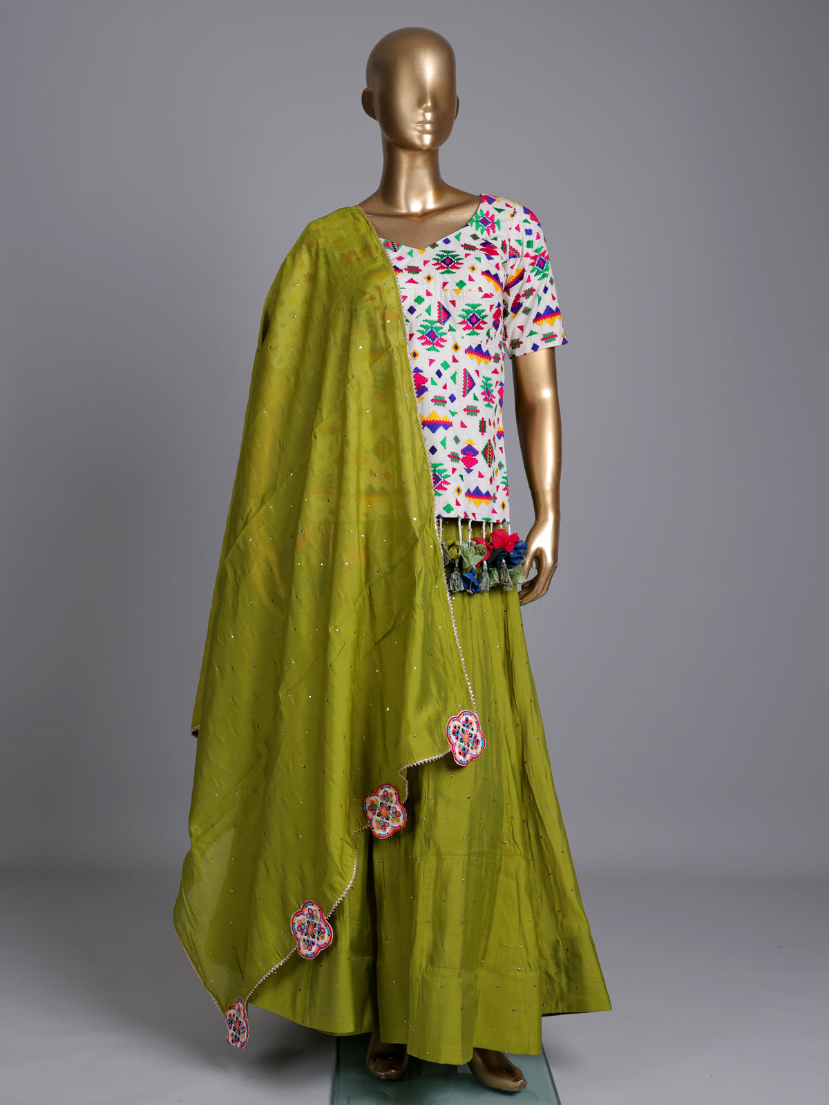 Green soft silk Navratri lehenga choli with delicate stone detailing