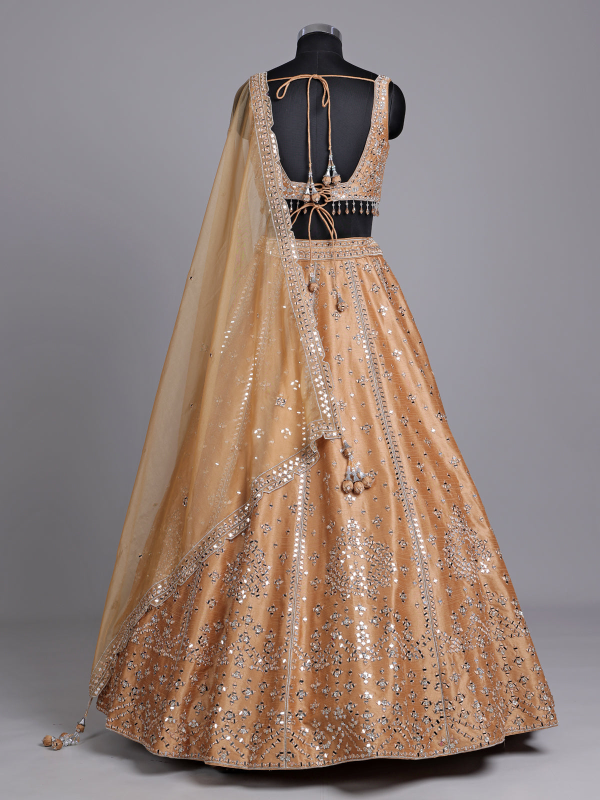 Peach raw silk lehenga choli with elegant diamond and aabla work