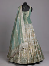 Pista green silk lehenga choli with mirror and zardosi work