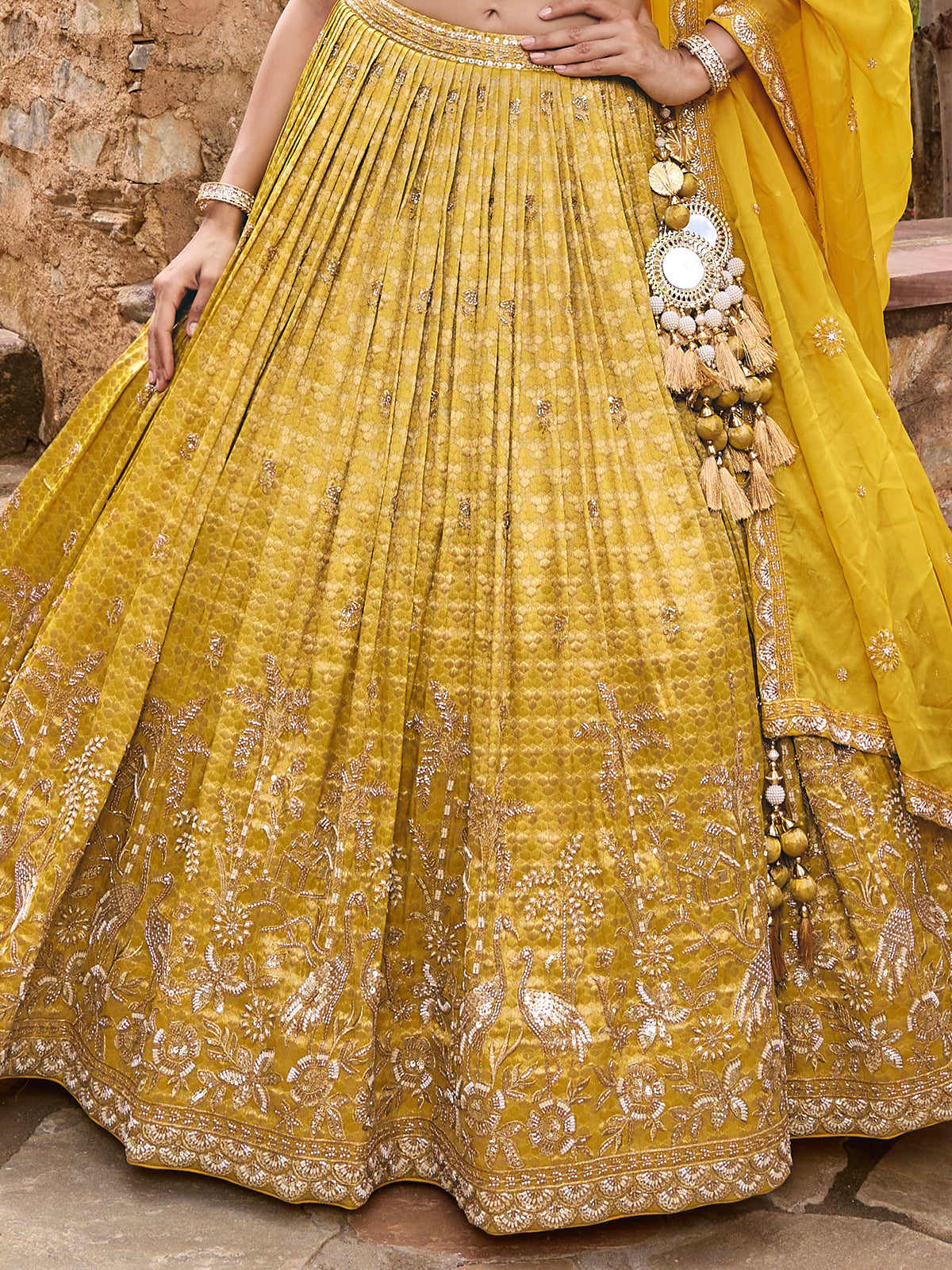 Mustard yellow silk lehenga choli with embellished festive dupatta