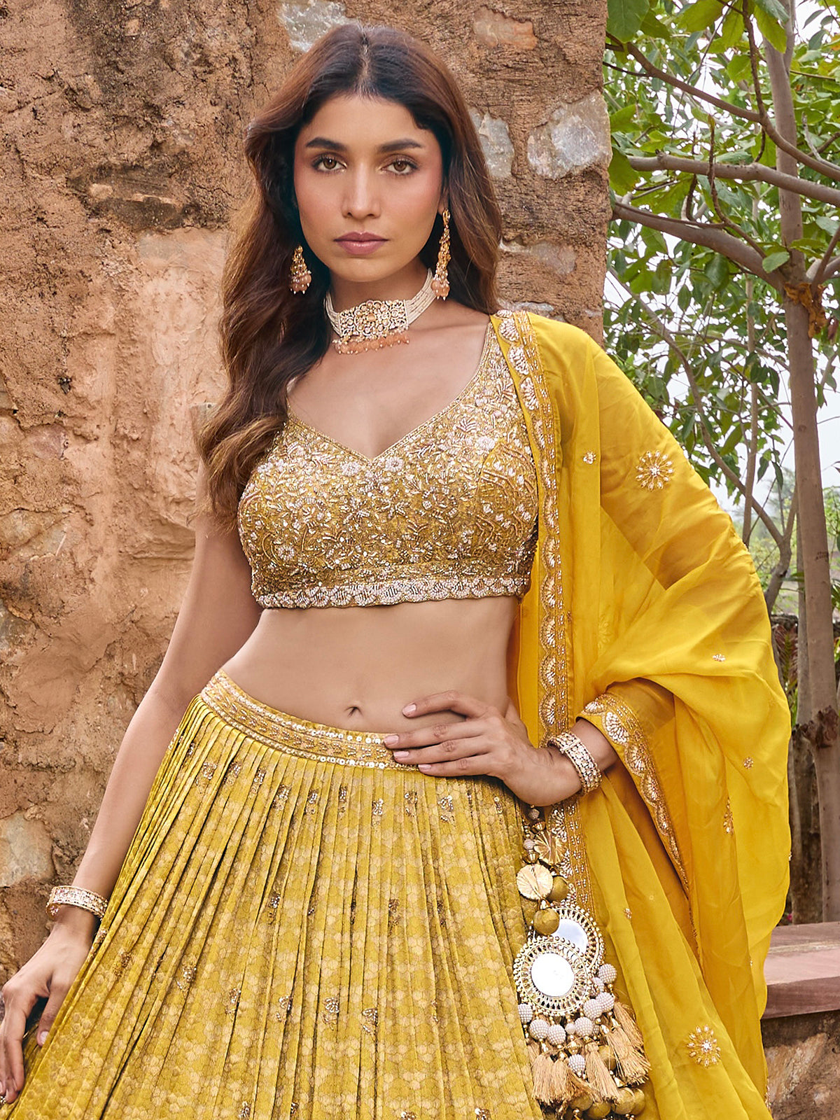 Mustard yellow silk lehenga choli with embellished festive dupatta
