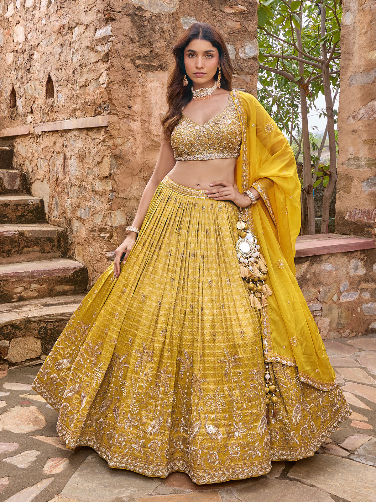 Mustard yellow silk lehenga choli with embellished festive dupatta