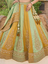 Mint green and gold silk lehenga choli with zig zag texture