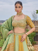 Mint green and gold silk lehenga choli with zig zag texture