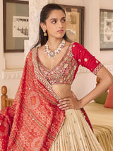 Beige silk lehenga choli with art motif and contrast dupatta