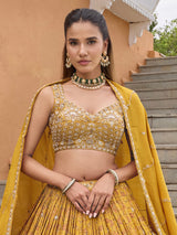 Mustard yellow silk lehenga choli with embellished dupatta