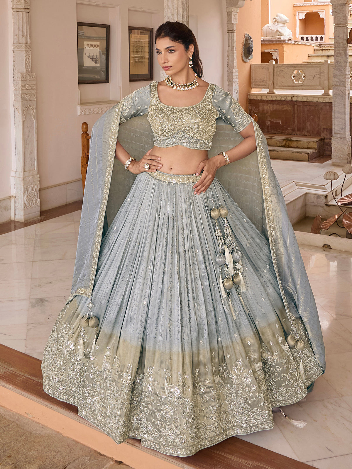 Light grey chiffon silk lehenga choli with peacock motifs