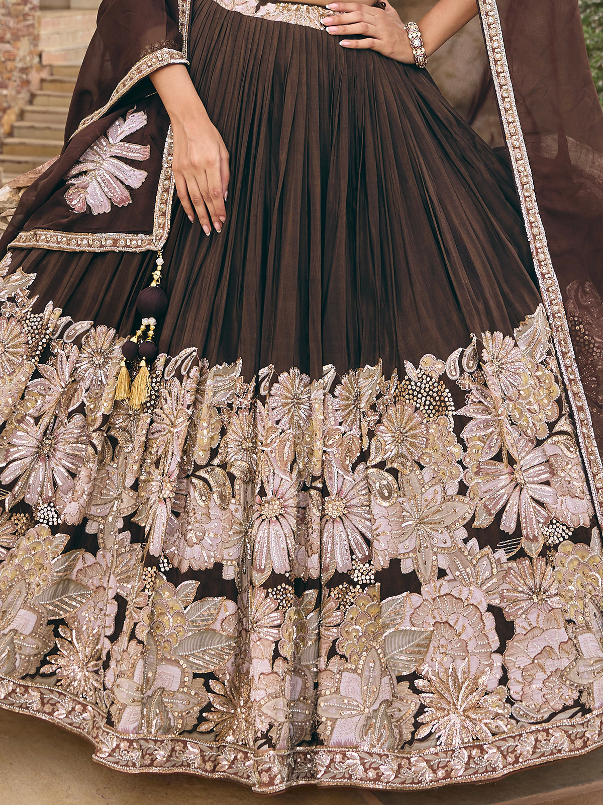 Dark brown soft silk lehenga choli with floral motif embellishments