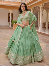 Pista green silk lehenga choli with embellished festive dupatta