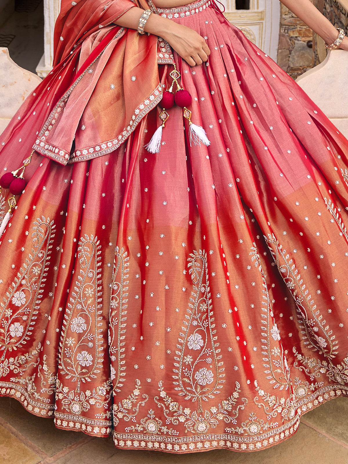 Pink silk lehenga choli with shaded dupatta and resham embellishments