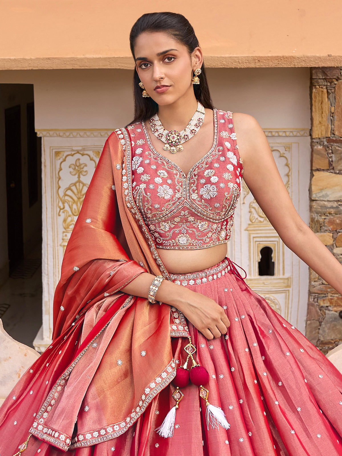 Pink silk lehenga choli with shaded dupatta and resham embellishments