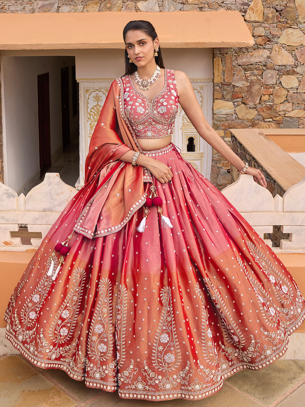 Pink silk lehenga choli with shaded dupatta and resham embellishments