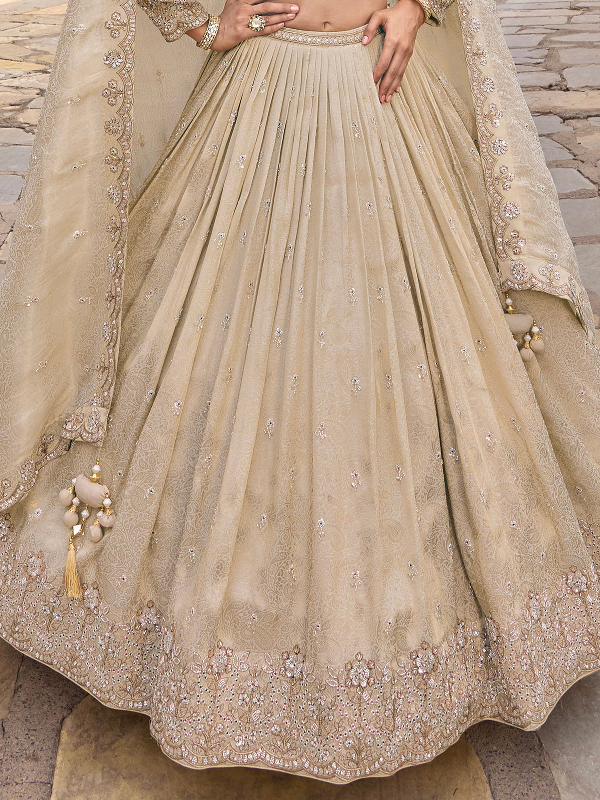 Beige silk lehenga choli with designer dupatta and zari texture