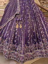 Purple silk lehenga choli with Rajasthani style embellished dupatta