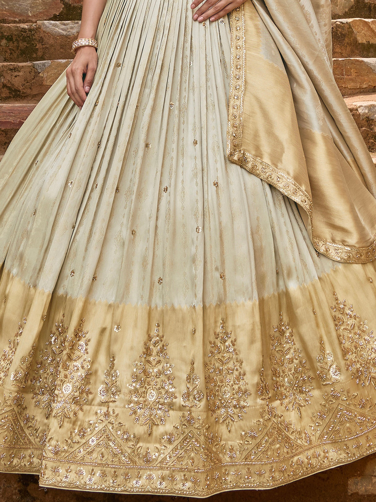 Cream silk lehenga choli with designer shaded embellished dupatta