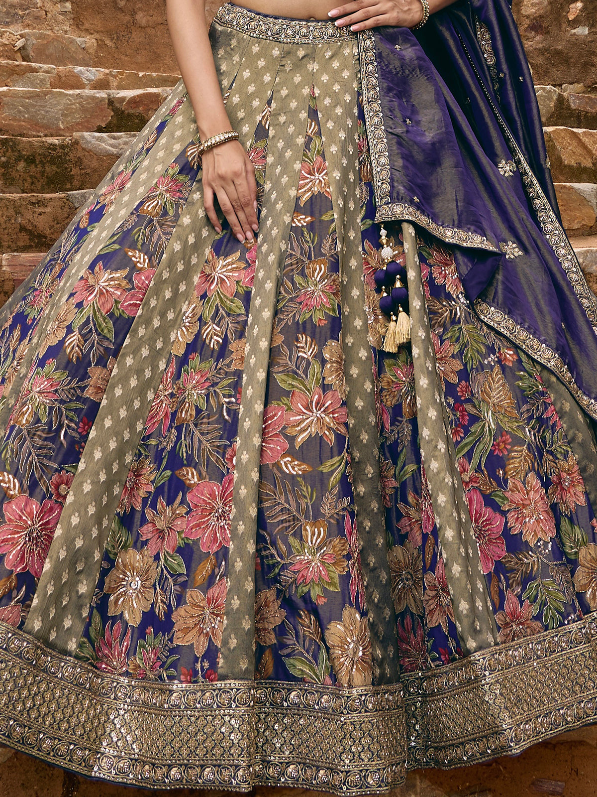 Blue silk lehenga choli with floral motifs and embellished dupatta