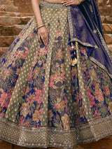 Blue silk lehenga choli with floral motifs and embellished dupatta