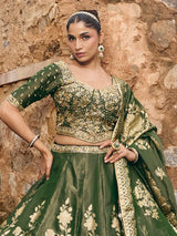 Mehendi green silk lehenga choli with embellished festive dupatta
