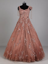 Dusty peach ball gown with floral embellishments and fringe
