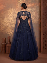 Midnight navy ball gown with embellished cape and flared skirt