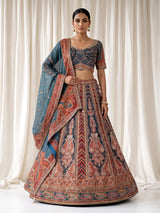 Teal blue lehenga choli with rust paisley detailing
