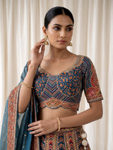 Teal blue lehenga choli with rust paisley detailing