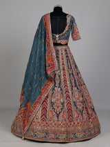 Teal blue lehenga choli with rust paisley detailing