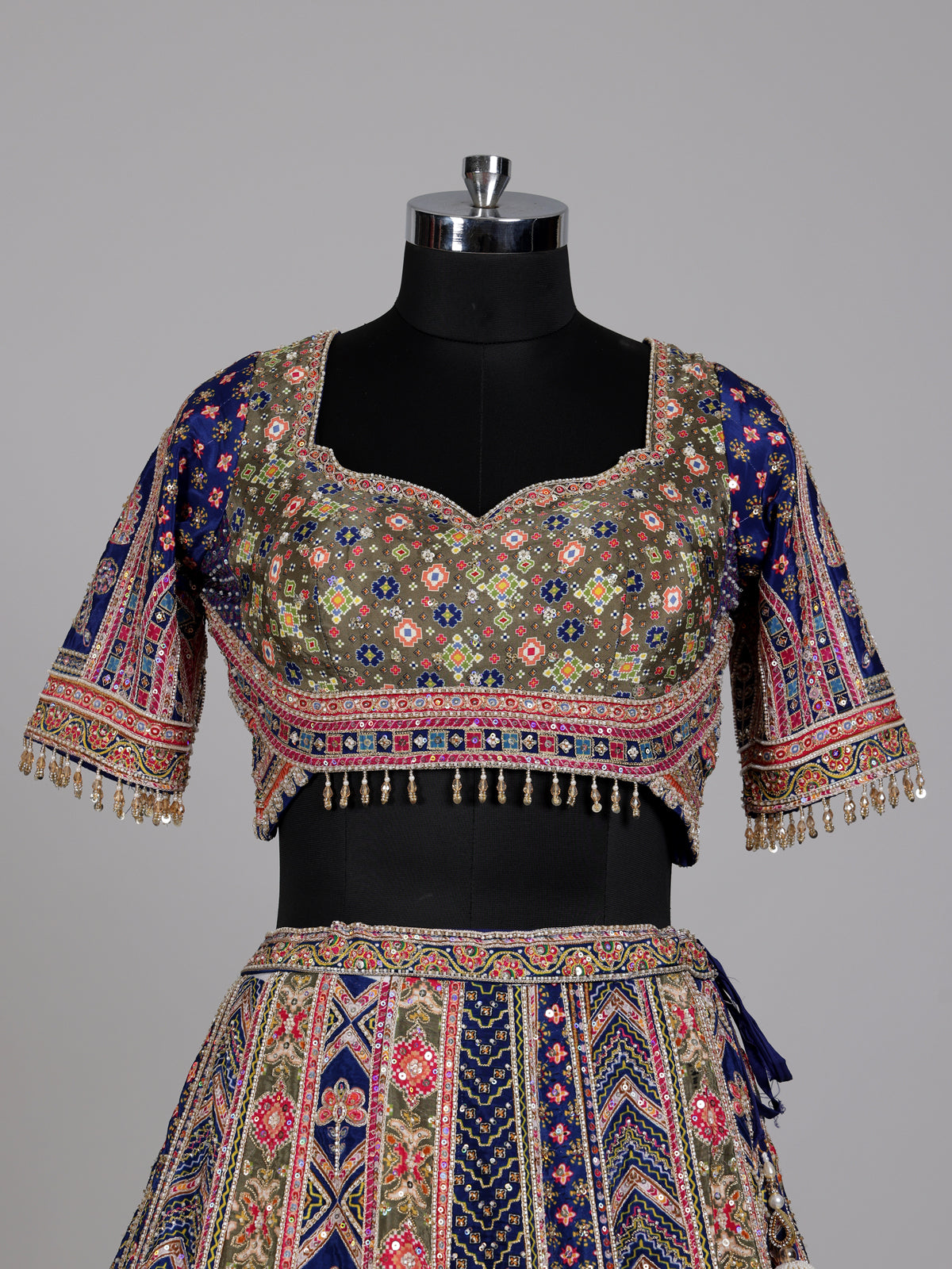 Blue olive lehenga choli with traditional bandhani inspired motifs