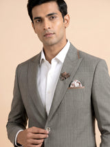 Light grey single-breasted blazer with floral brooch