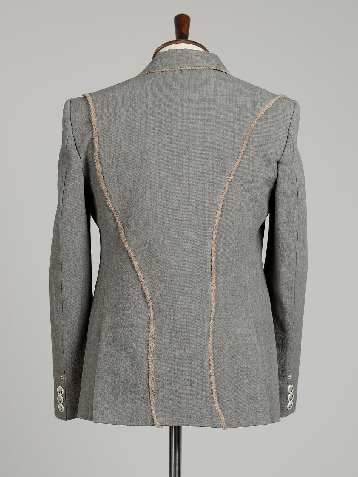 Light grey single-breasted blazer with floral brooch