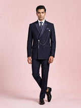Midnight navy double-breasted tuxedo suit with metallic brooch
