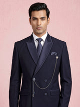 Midnight navy double-breasted tuxedo suit with metallic brooch