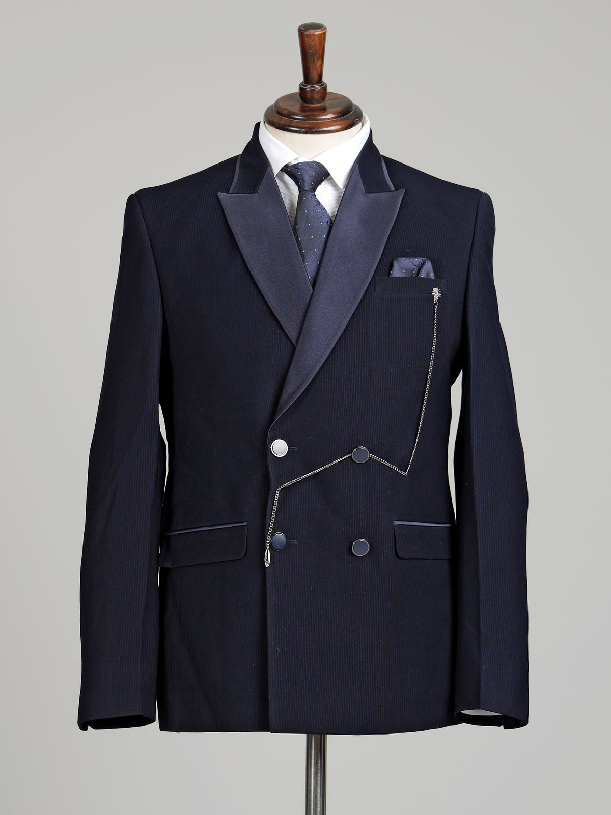 Midnight navy double-breasted tuxedo suit with metallic brooch