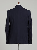 Midnight navy double-breasted tuxedo suit with metallic brooch