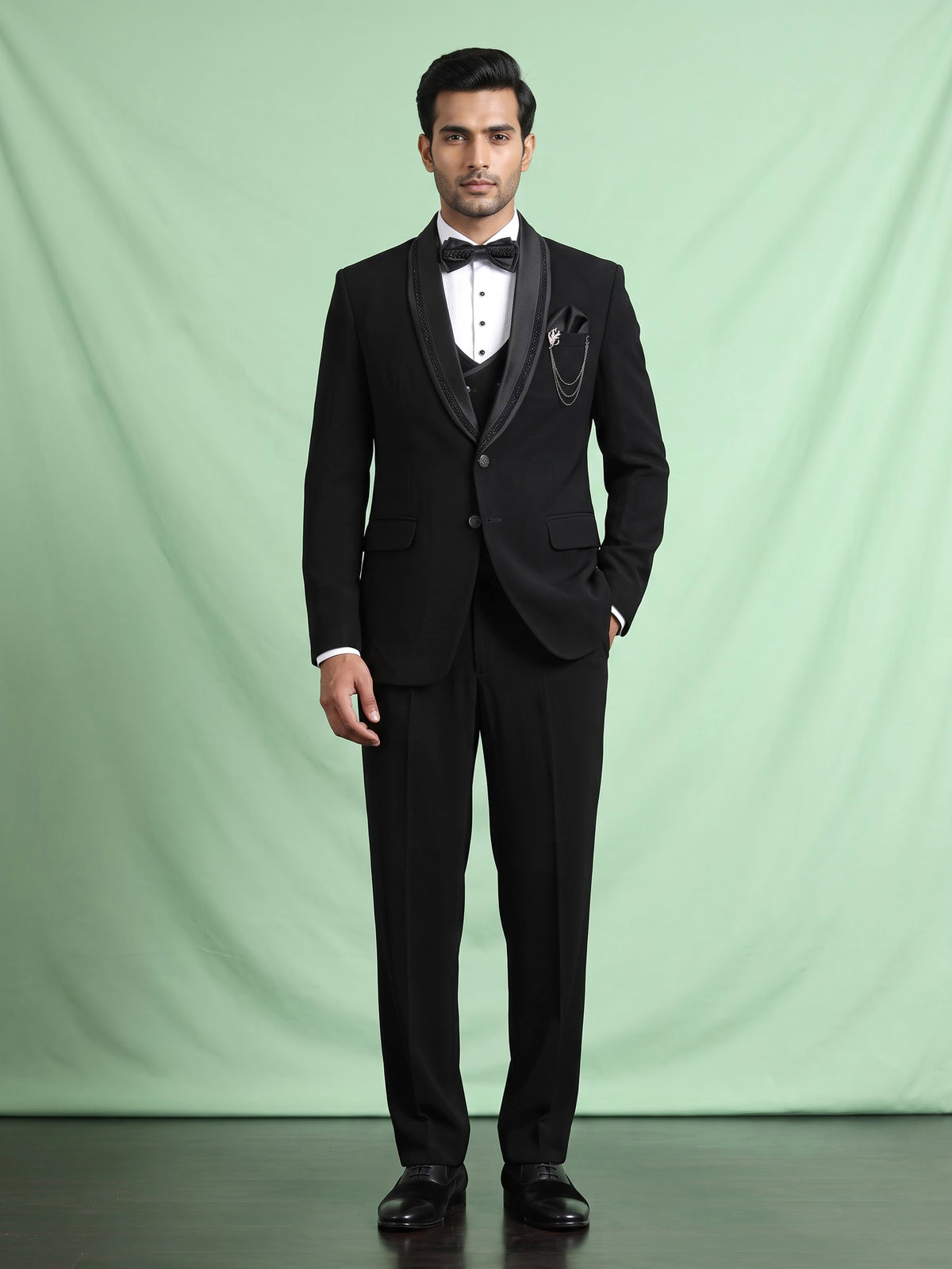 Black three-piece tuxedo suit with crystal bow tie