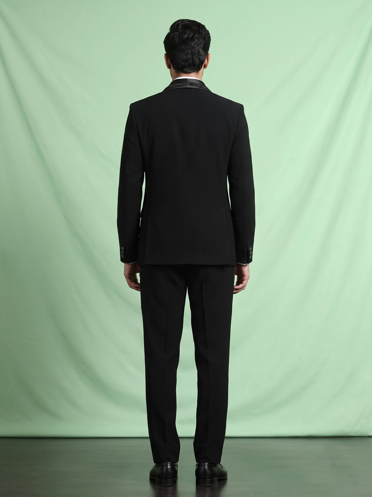 Black three-piece tuxedo suit with crystal bow tie