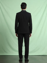 Black three-piece tuxedo suit with crystal bow tie
