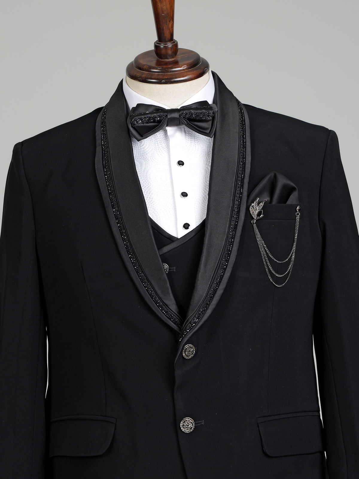 Black three-piece tuxedo suit with crystal bow tie