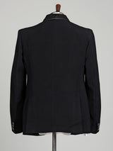 Black three-piece tuxedo suit with crystal bow tie