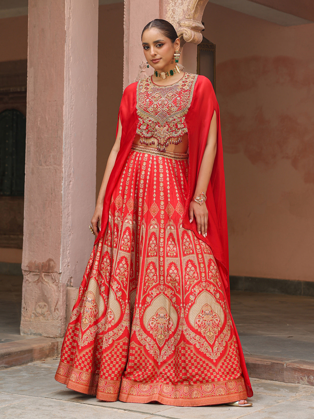Red traditional printed lehenga choli with heavy work cape jacket