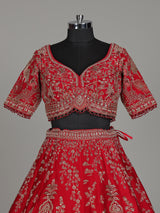 Red raw silk bridal lehenga with double dupatta and art motifs