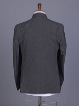 Charcoal grey double-breasted suit with black satin lapels