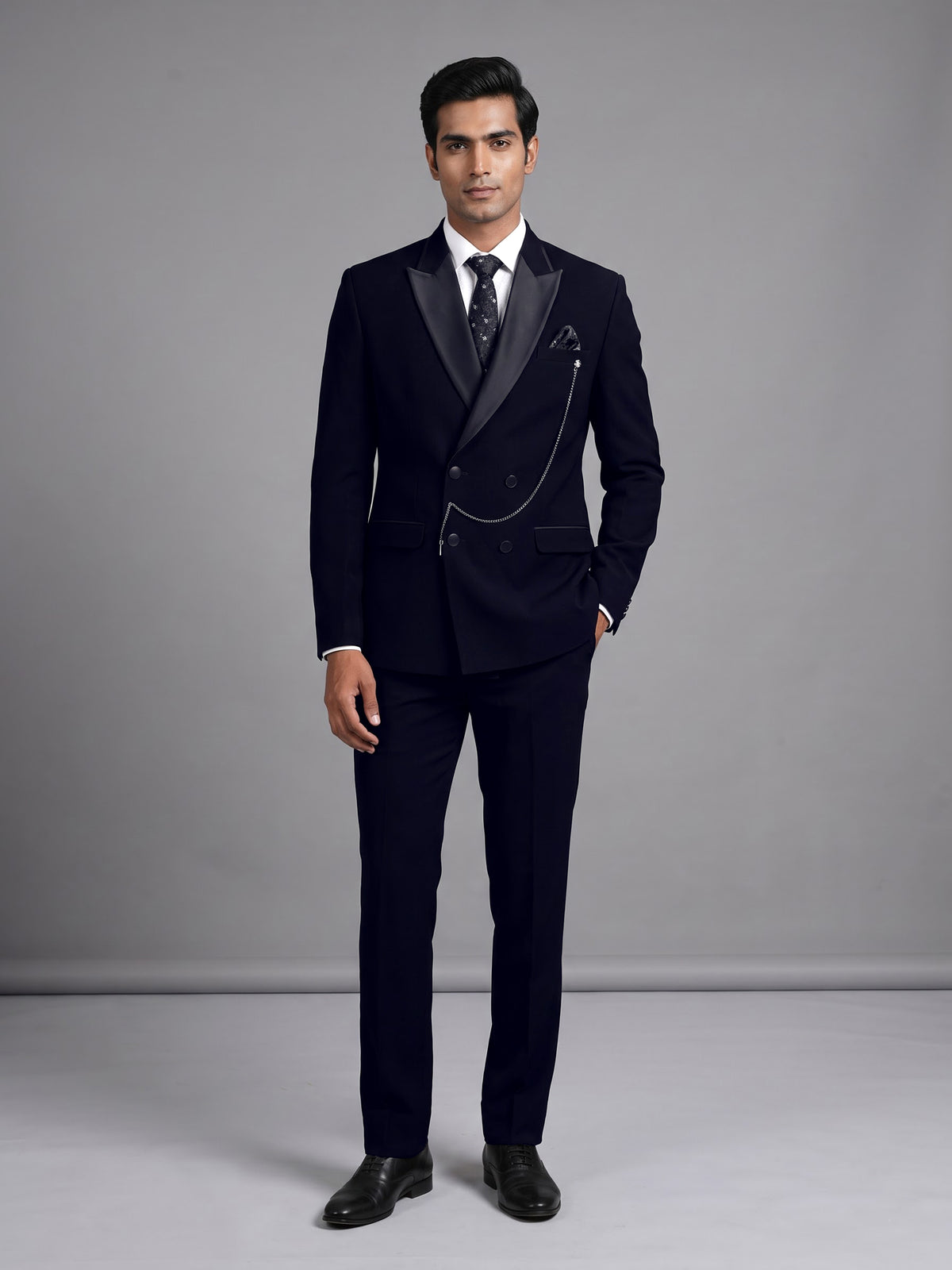 Black terry rayon double-breasted tuxedo suit with crystal brooch
