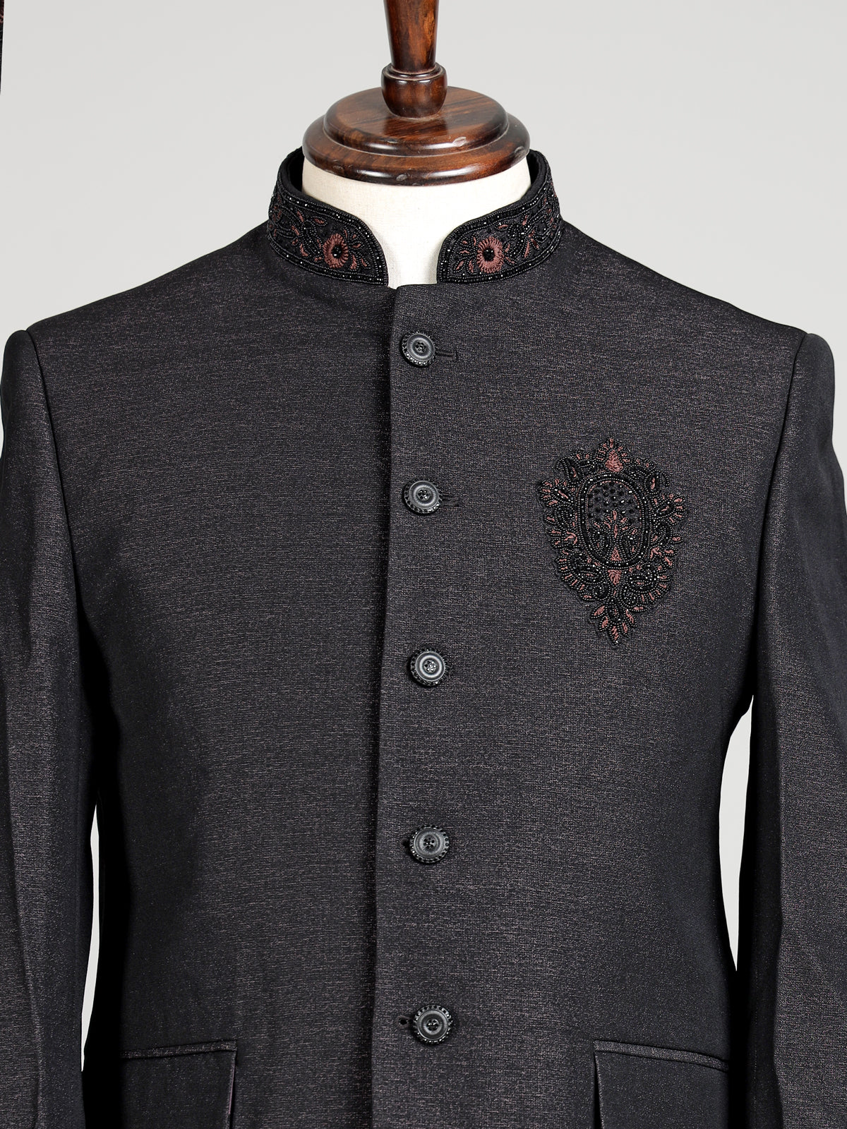 Jet black textured jodhpuri suit for mens with crest motif